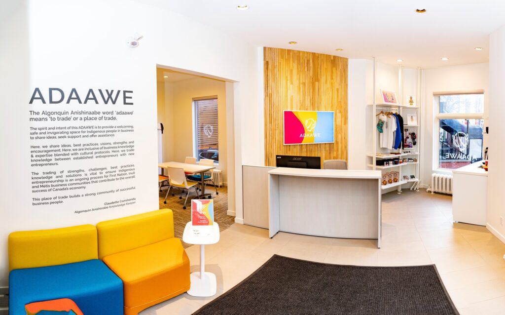 The entrance to the ADAAWE space in Ottawa, Ontario with colourful chairs in the foreground and the hub's pop-up store in the background.